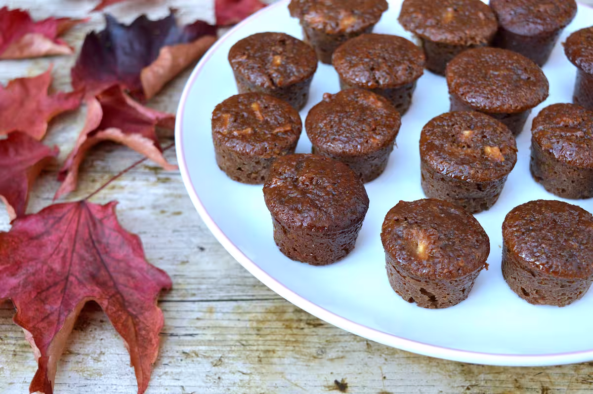 Partial view of a plate of sticky ginger apple cakes.