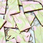 Christmas chocolate bark pieces - dark chocolate covered in swirled cranberry and matcha white chocolate.