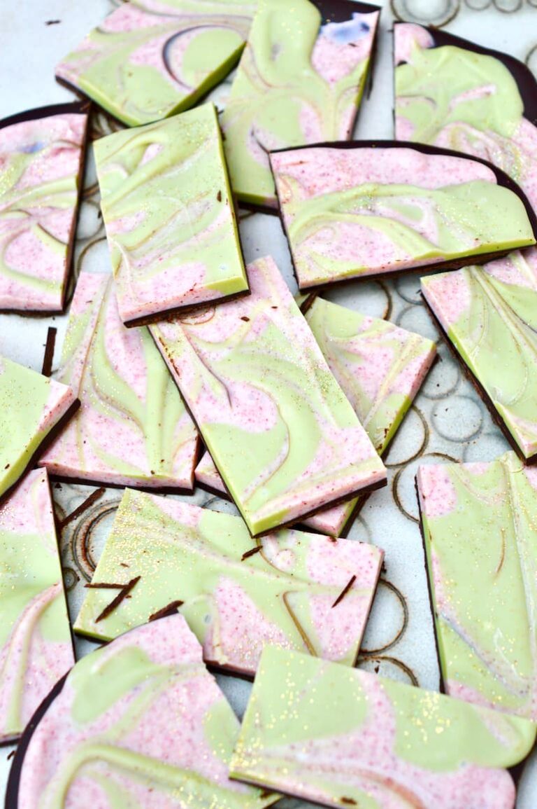 Christmas chocolate bark pieces - dark chocolate covered in swirled cranberry and matcha white chocolate.