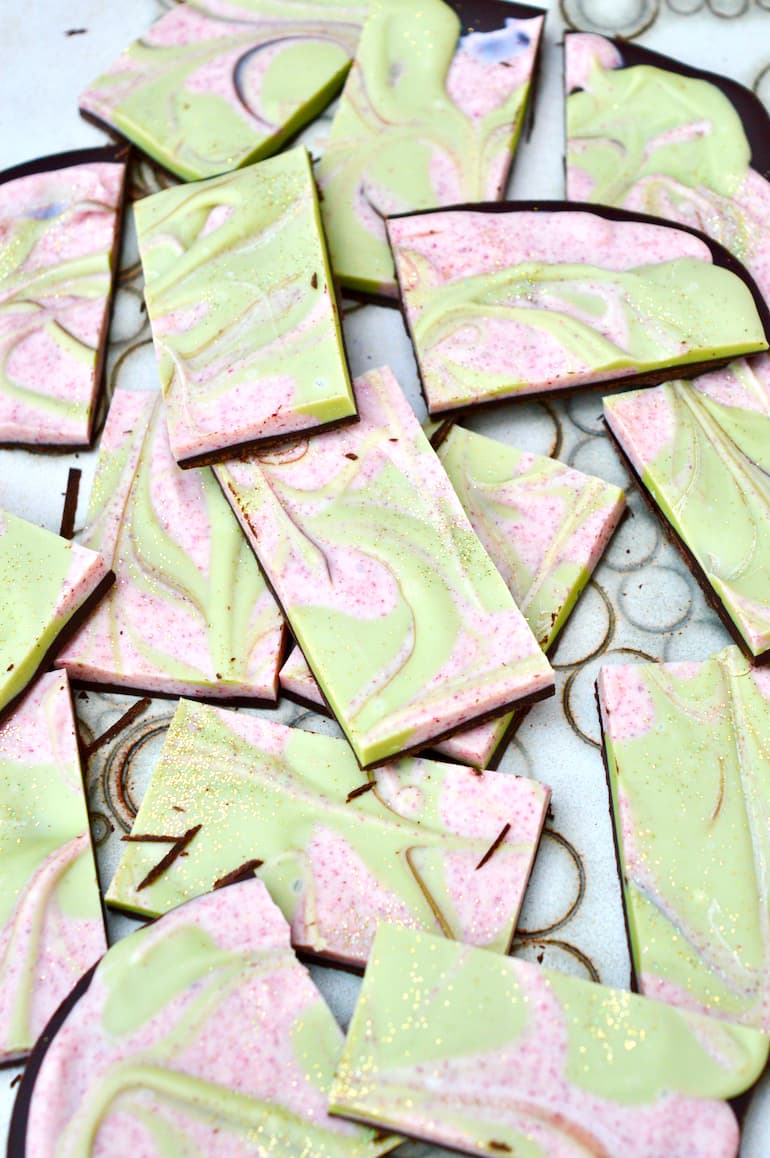 Christmas chocolate bark pieces - dark chocolate covered in swirled cranberry and matcha white chocolate.