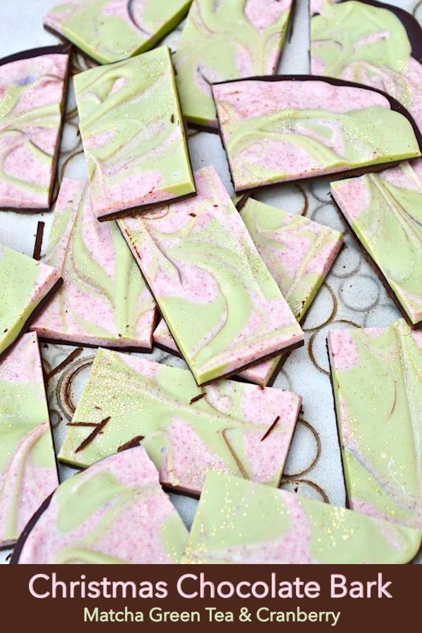 Christmas Chocolate Bark - a layer of dark chocolate covered in swirled white chocolate flavoured with cranberries and matcha green tea. Makes a perfect festive gift at Christmas or any other time. #tinandthyme #christmasrecipe #chocolatebark #christmasbark #recipe #christmas #matcha #greentea #cranberries #darkchocolate #whitechocolate