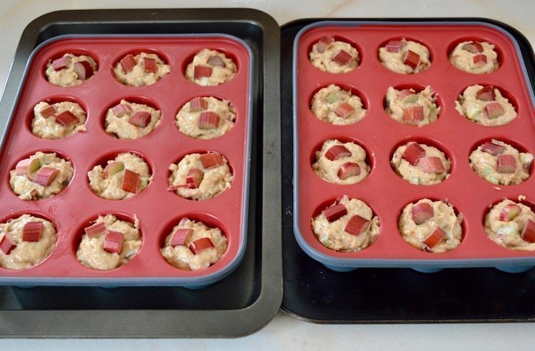 Spelt rhubarb muffin batter in mini muffin trays.