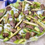 Summer Sausage Salad with avocado, asparagus, potato salad, bean dip & green herb dressing.
