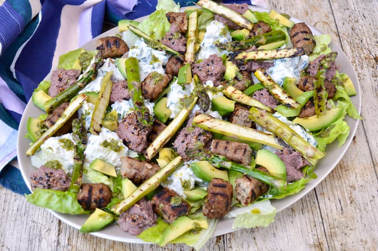 Summer Sausage Salad with avocado, asparagus, potato salad, bean dip & green herb dressing.