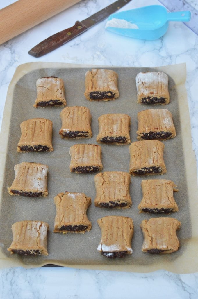 Marked and flattened fig rolls prior to baking.