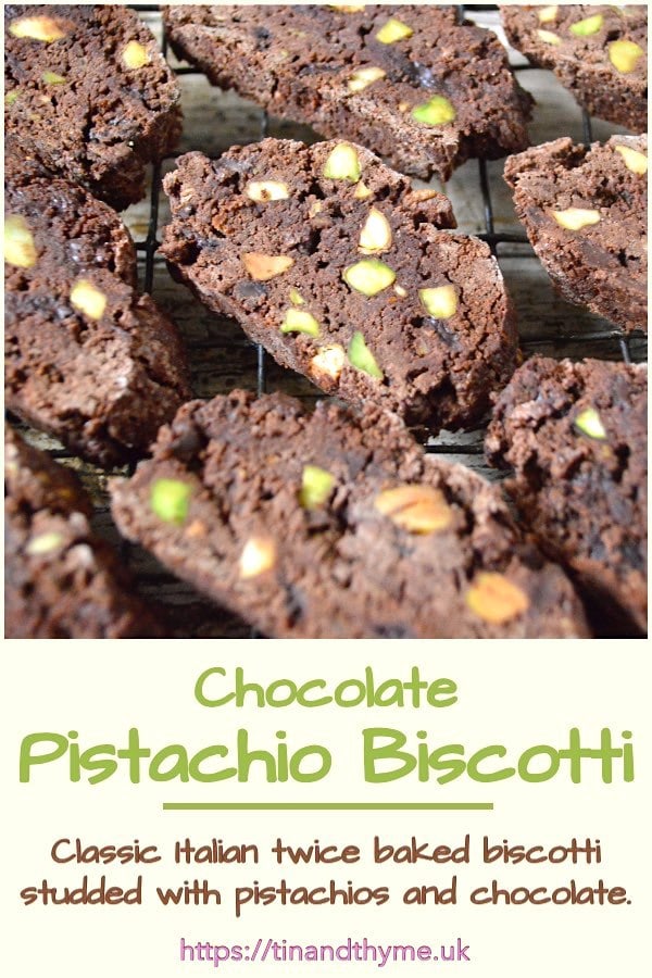 Gluten-free chocolate pistachio biscotti cooling on a wire rack.