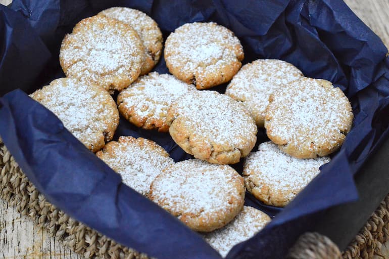 Maamoul cookies in a basket with two fillings.
