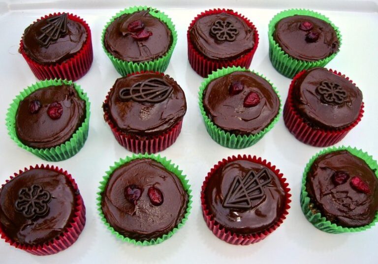 Twelve homemade Christmas cupcakes. with chocolate ganache.
