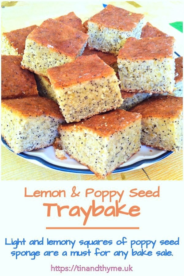 Lemon and poppy seed traybake cut into squares and piled on a plate.