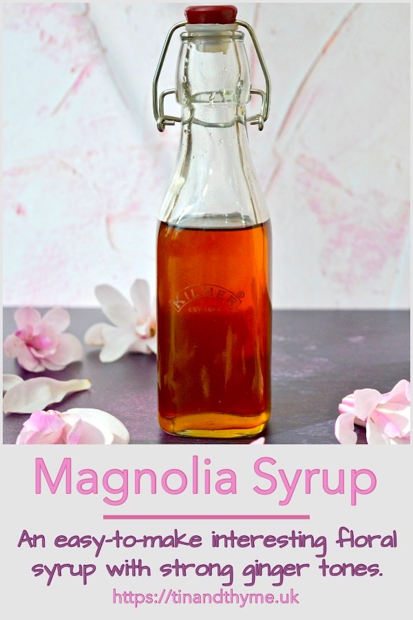 Bottle of magnolia syrup with blossoms.