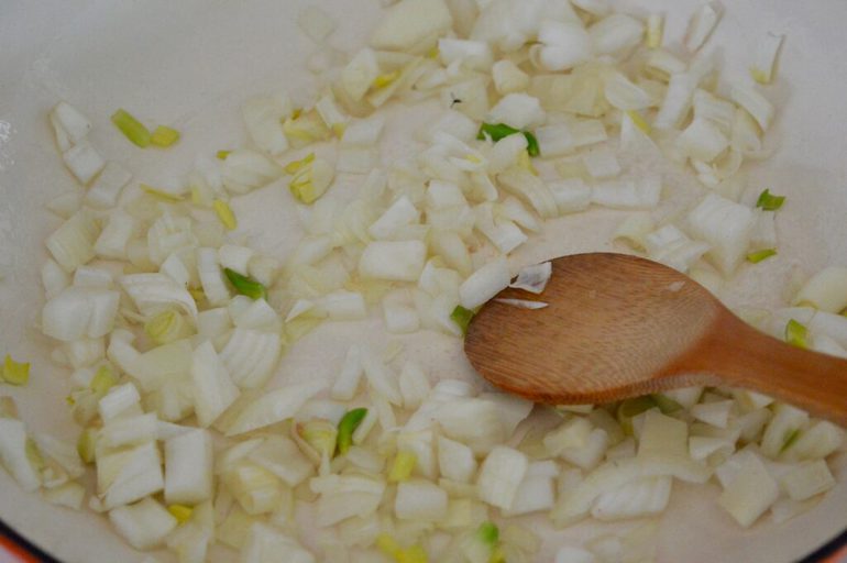 Onions frying in a pan.