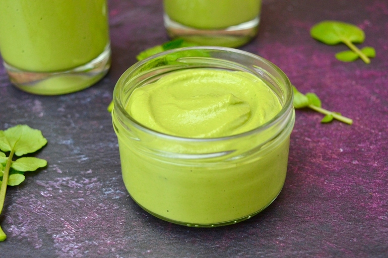 Open jar of watercress pesto.