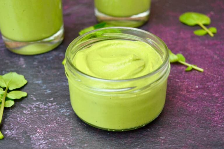 Open jar of watercress pesto.