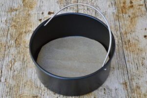 Air fryer cake tin with lining.