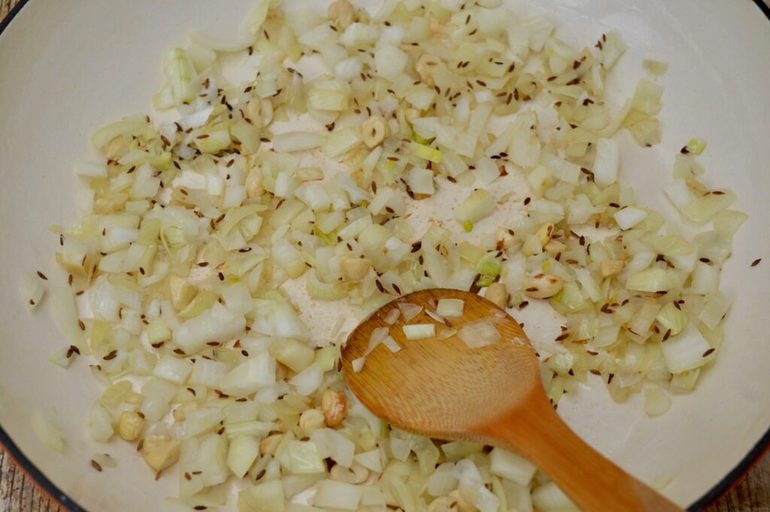 Frying onions, cashews & cumin seeds.