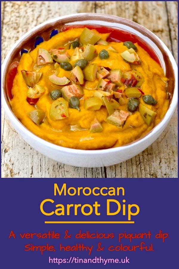Moroccan carrot dip in a bowl topped with chopped green olives and capers.