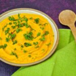 Moroccan carrot dip in a bowl and topped with parsley.