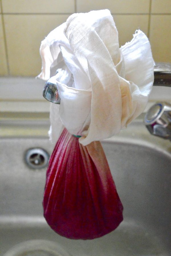 Jelly bag tied up over sink.