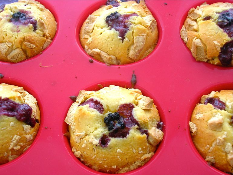 Blackberry and white chocolate lava cakes in baking mould.