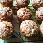 Apple Chocolate Chip Cream Cheese Muffins cooling on a wire rack.