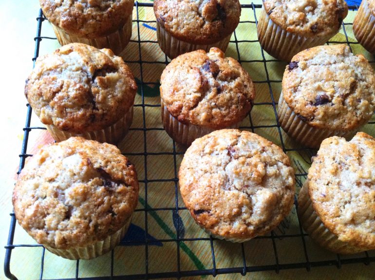 Apple Chocolate Chip Cream Cheese Muffins cooling on a wire rack.