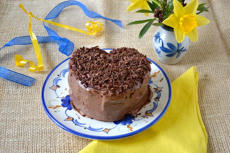 Heart shaped chocolate coconut cannellini cake filled and covered with vegan chocolate icing.