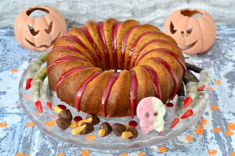 Spiced orange pumpkin cake with Halloween decorations.