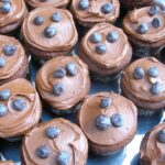 A tray of mini chocolate surprise cakes.