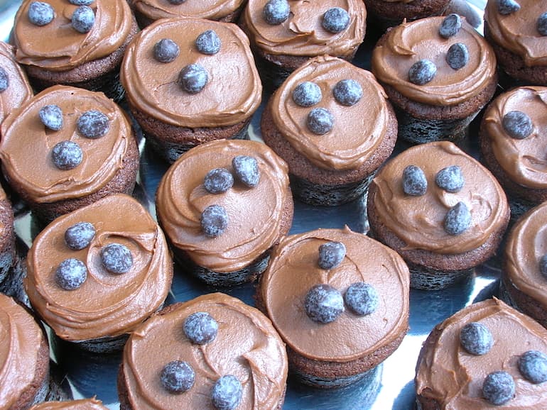 A tray of mini chocolate surprise cakes.