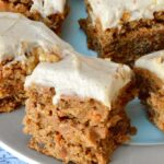 Slabs of healthy vegan carrot cake on a plate.