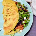 A folded Asian-style red cabbage vegan omelette.