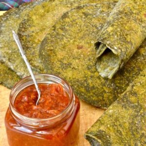 Nettle and wild garlic green flatbreads with a jar of tomato chilli chutney.