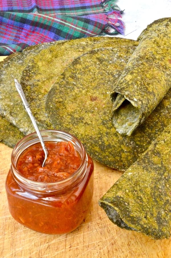 Nettle and wild garlic green flatbreads with a jar of tomato chilli chutney.