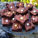 A glass plate full of Easter simnel brownies.