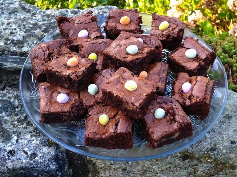 A glass plate full of Easter simnel brownies.