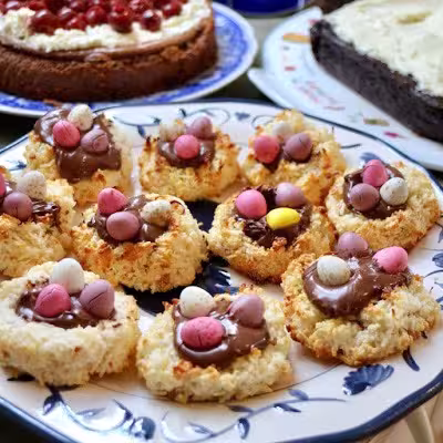 Easter macaroon egg nests on plate.