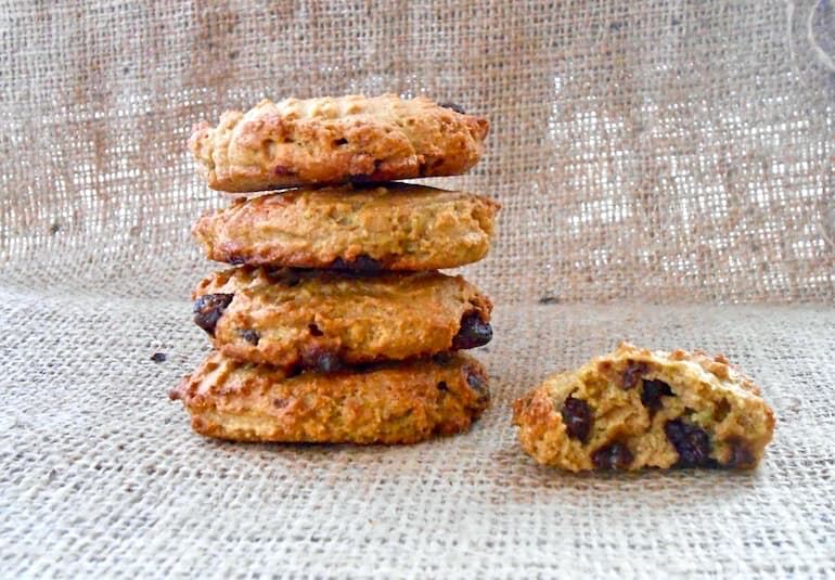 A stack of dairy-free chocolate chip avocado cookies, plus a half one.