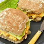 Two rolls with homemade vegetarian carrot and cheese sandwich filling.