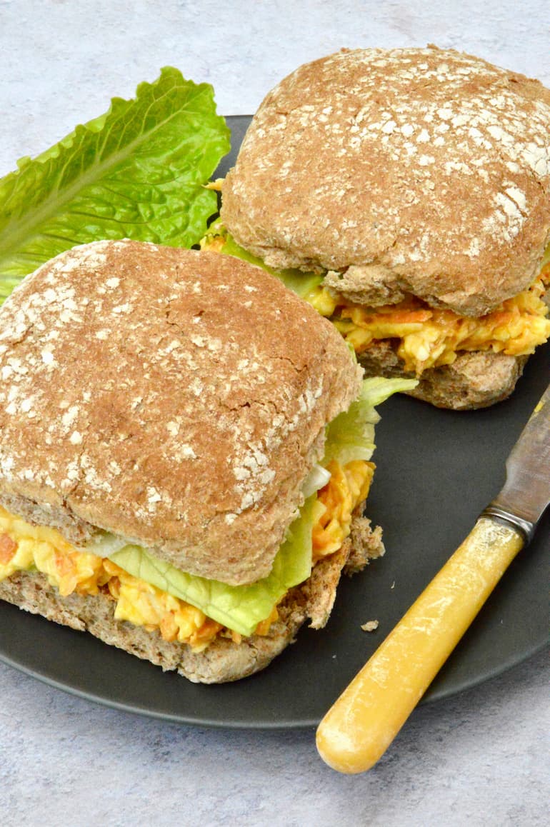 Two rolls with homemade vegetarian carrot and cheese sandwich filling.