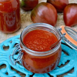 An open jar of easy homemade tomato sauce.