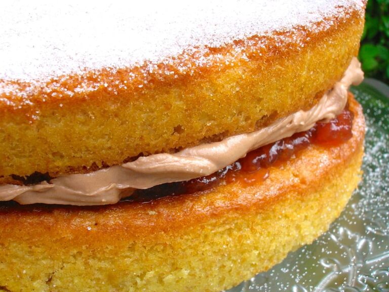 One side of a chocolate buttercream victoria sandwich cake.