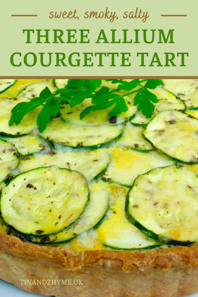 Close up of a courgette tart. Text box reads "Three Allium Courgette Tart".