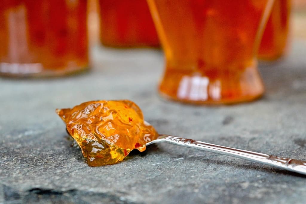 Spoonful of quince jelly with apples and chilli.