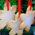 Chilli shortbread biscuits threaded with red ribbon to hang on the Christmas tree.