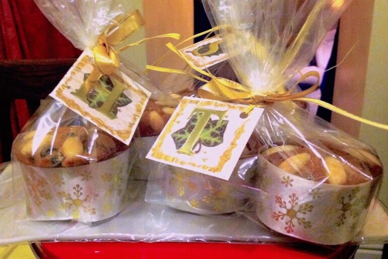 Individual homemade mini Dundee cakes all wrapped up for Christmas.