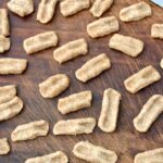 Board full of homemade whole wheat vegan cavatelli pasta dough.