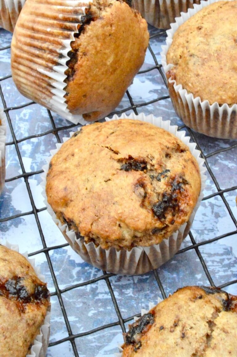 Close up of whole wheat vegan mincemeat muffins cooling on a wire rack.