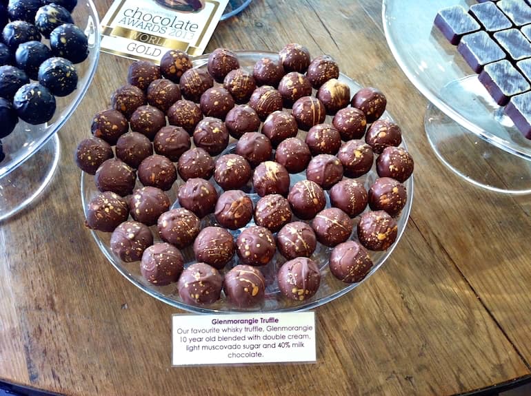A glass platter of Paul A Young's Glenmorangie whisky truffles.
