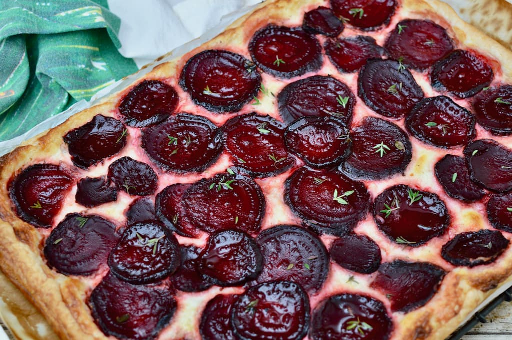 Close up of a baked roasted beetroot puff pastry galette.