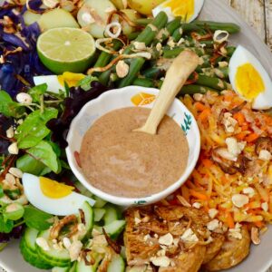 Gado gado Indonesian salad platter complete with bowl of spicy peanut sauce.
